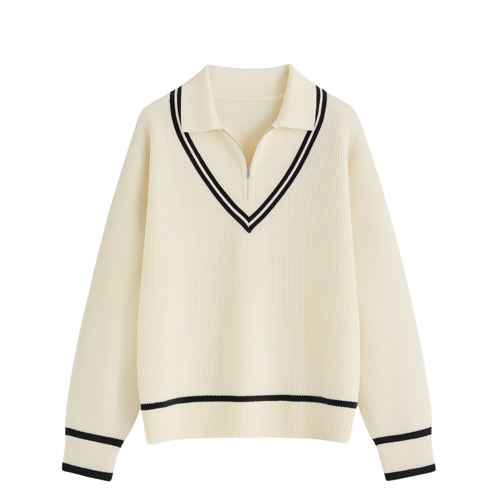 Cream-colored sweater with black trim on a white background